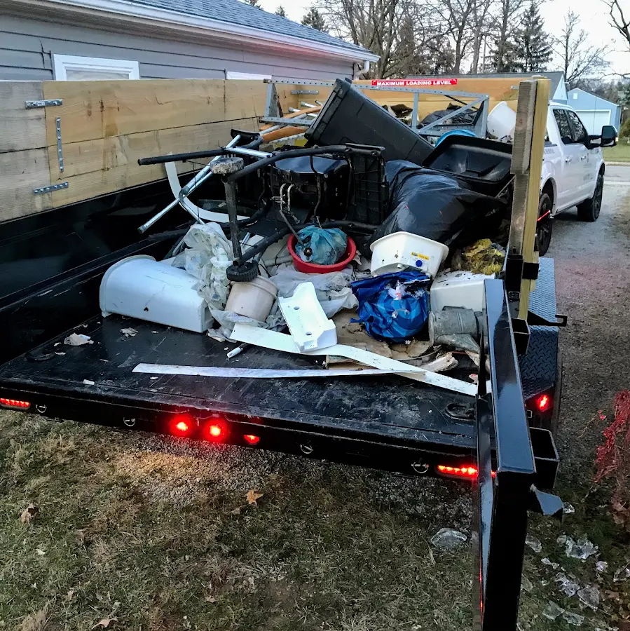 Roll-off dumpster delivered to a residential driveway in Flushing