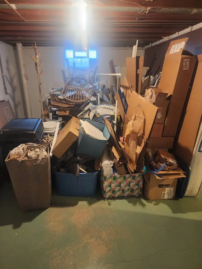 Roll-off dumpster container at job site for 15 Yard Dumpster Rental in Flushing